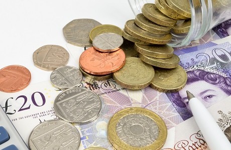 UK coins and bank notes representing Money insurance